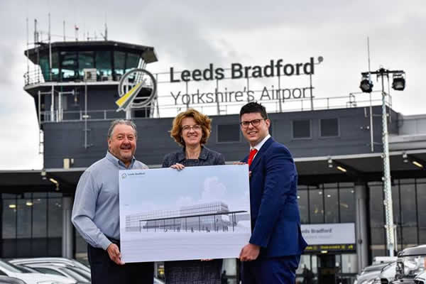 staff from leeds bradford airport hold development plans for terminal expansion