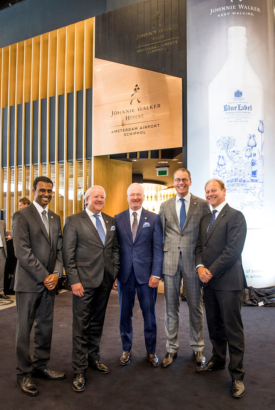 Celebrating the Striding Man (l-r): Diageo GTME Regional Director Dayalan Nayagar, Gebr Heinemann Head of Wines & Spirits Rudiger Stelkens, Gebr Heinemann Director Purchasing & Logistics Kay Spanger, Schiphol Airport Retail MD Peter-Jan Rozenburg and Diageo GTME Managing Director Doug Bagley at the opening (Photo: Marco Hofste)