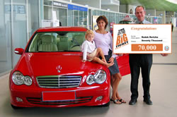 The Winner of the 'Triple Your Chances' deal Radek Rericha collects his prizes with his wife and two-year-old daughter Annie