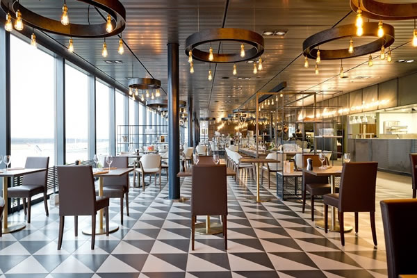 The restaurant is described as a "loft spirit which is open and luminous in a neo-industrial style"