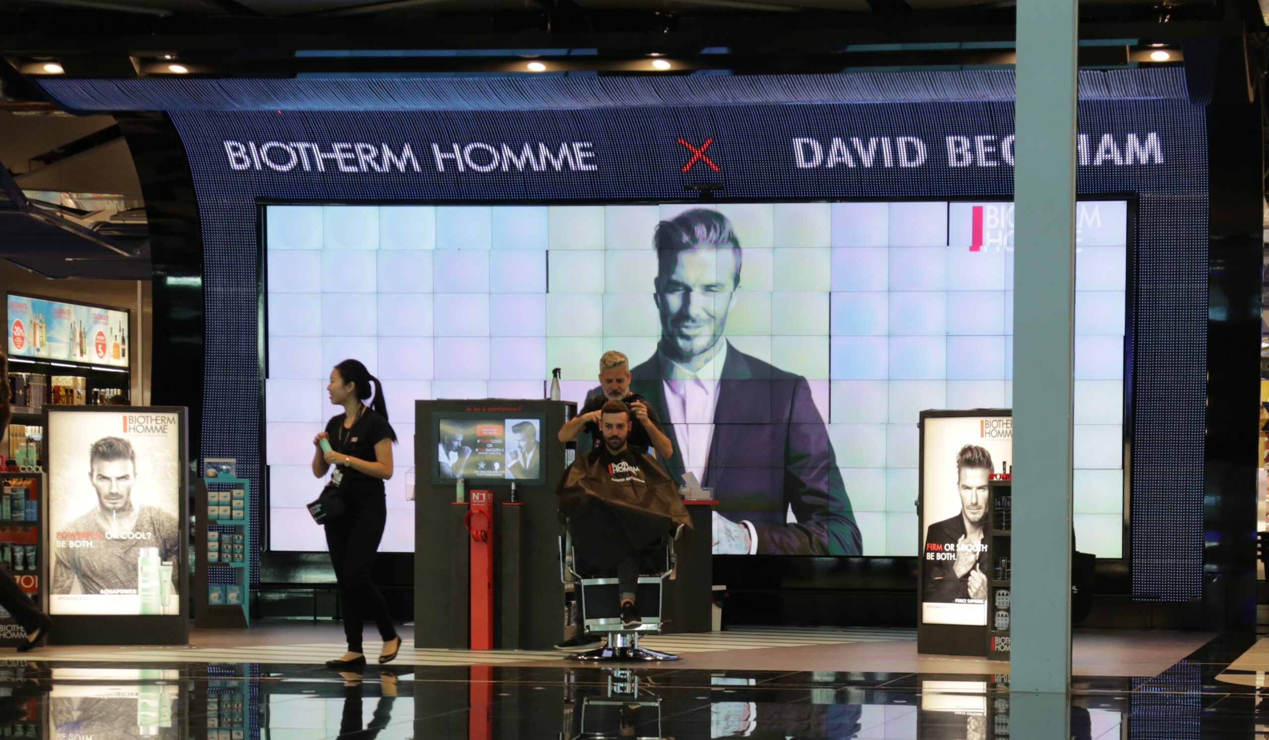 David Beckham welcomes travellers at Barcelona Airport
