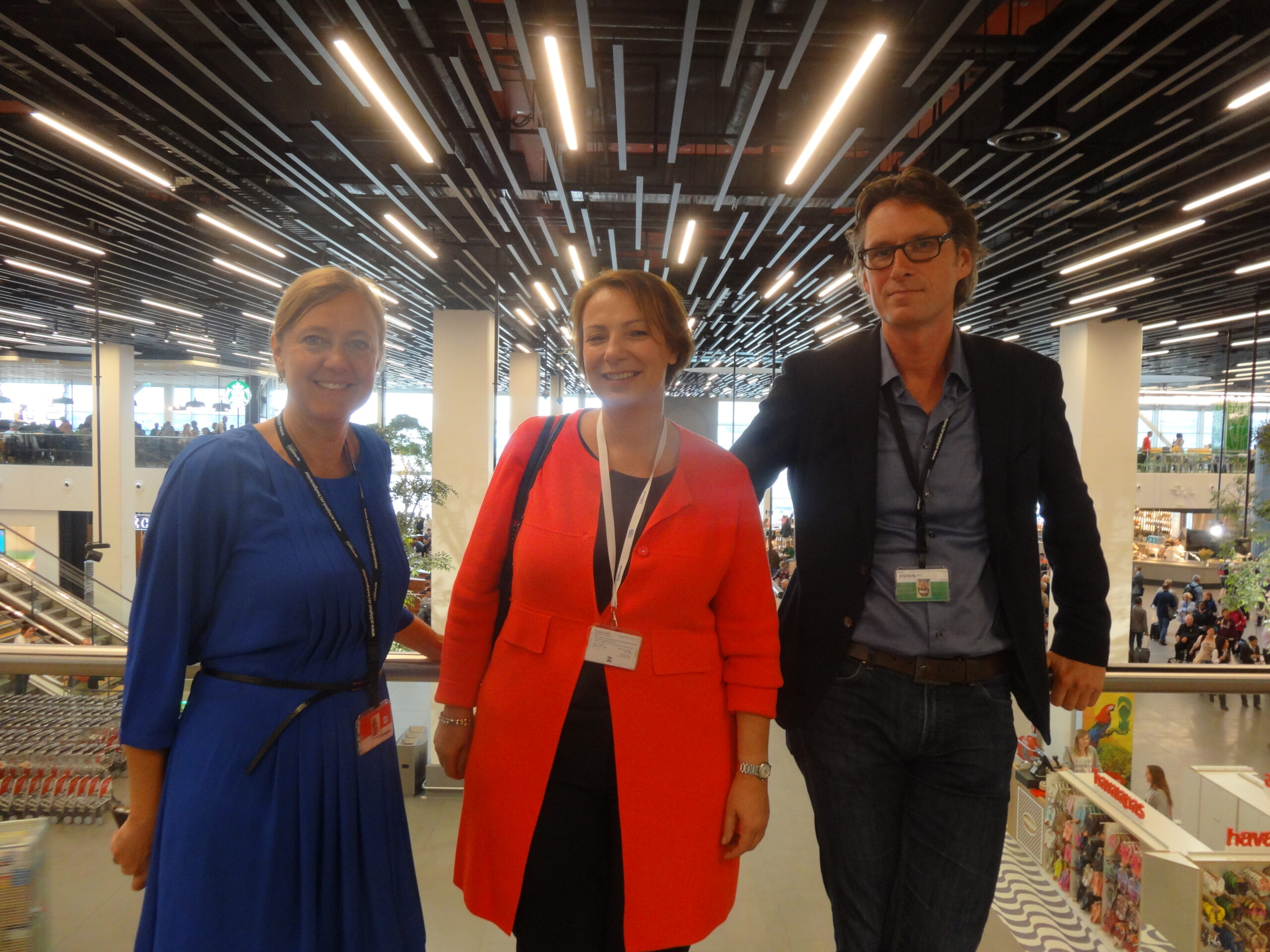 Light show: Schiphol Group's Tanja Dik, Anne-Marie Zuidweg and Gideon Ruig at the entrance to Lounge 2, with one of the many striking roof lighting features behind