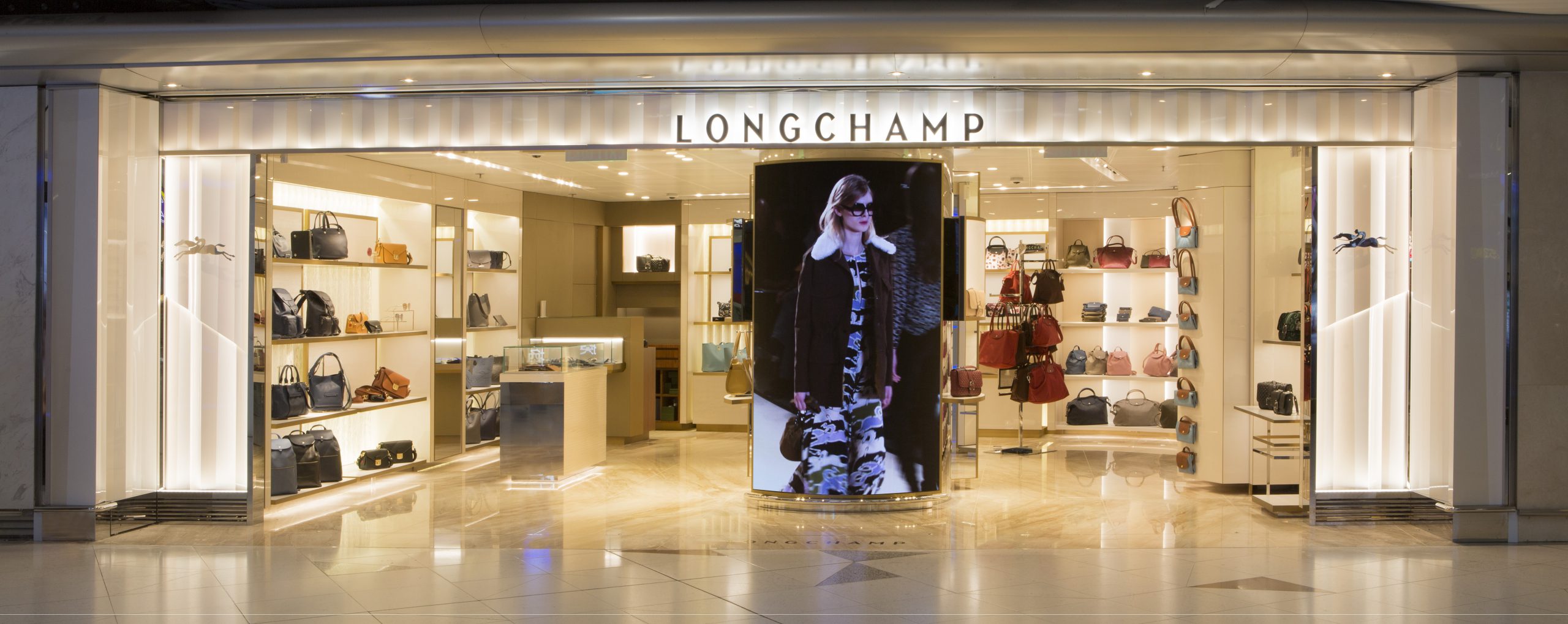 A spirit of modernity Dufry opens Longchamp boutique at Hong Kong International Airport Moodie Davitt Report