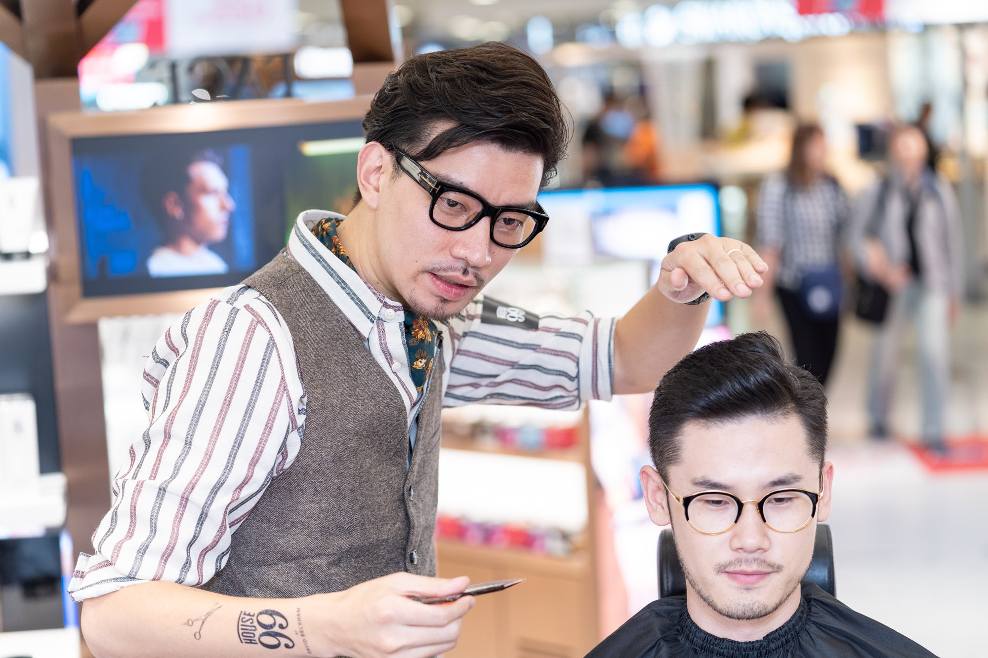 Influencer being styled at launch of The Shilla Duty Free House 99 by David Beckham pop-up at Hong Kong International Airport