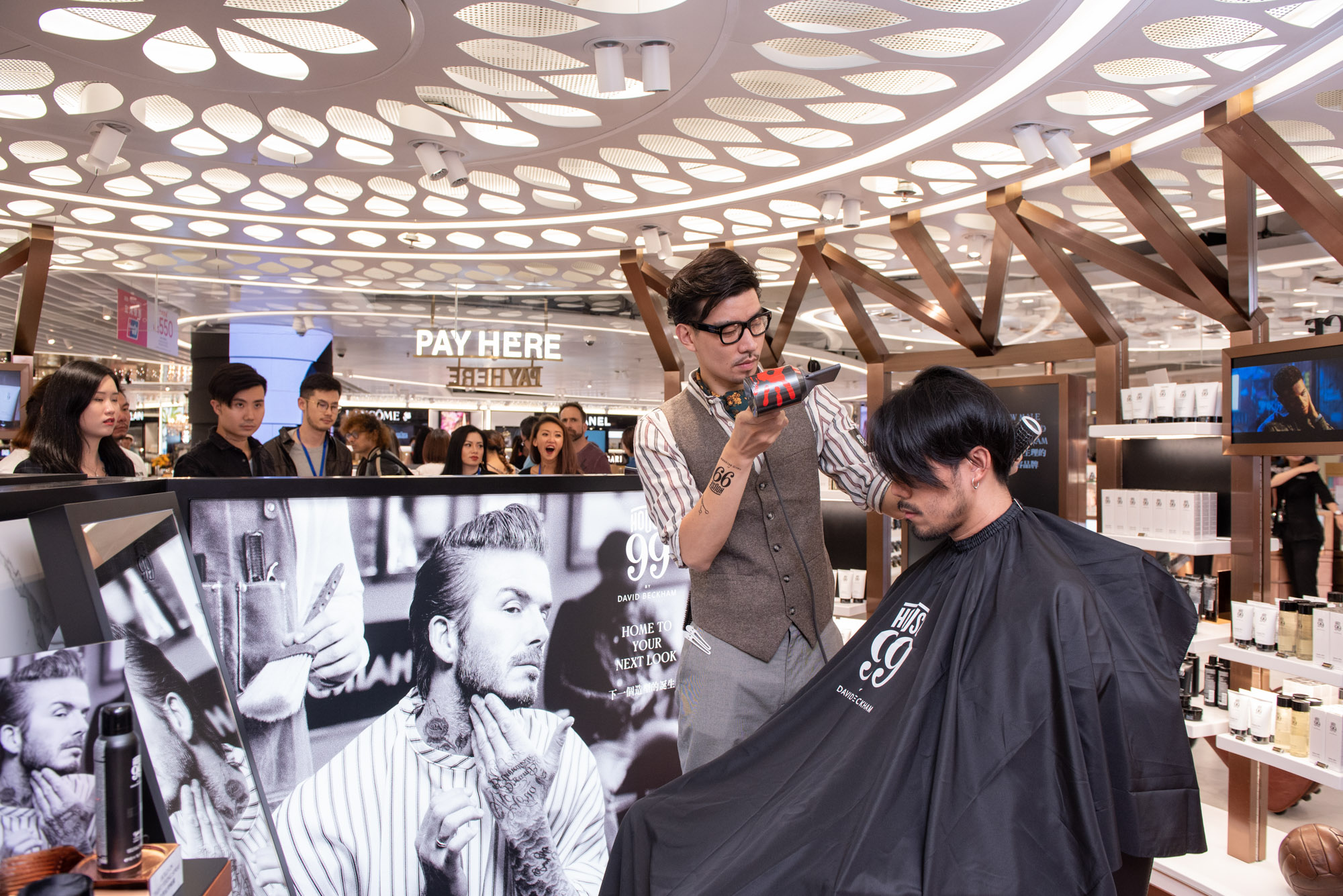 Influencer being styled at launch of The Shilla Duty Free House 99 by David Beckham pop-up at Hong Kong International Airport