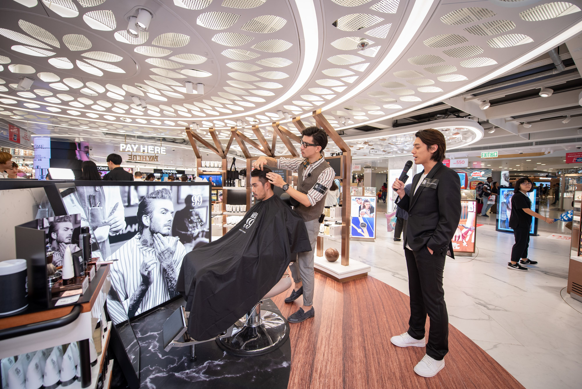 Influencer being styled at launch of The Shilla Duty Free House 99 by David Beckham pop-up at Hong Kong International Airport