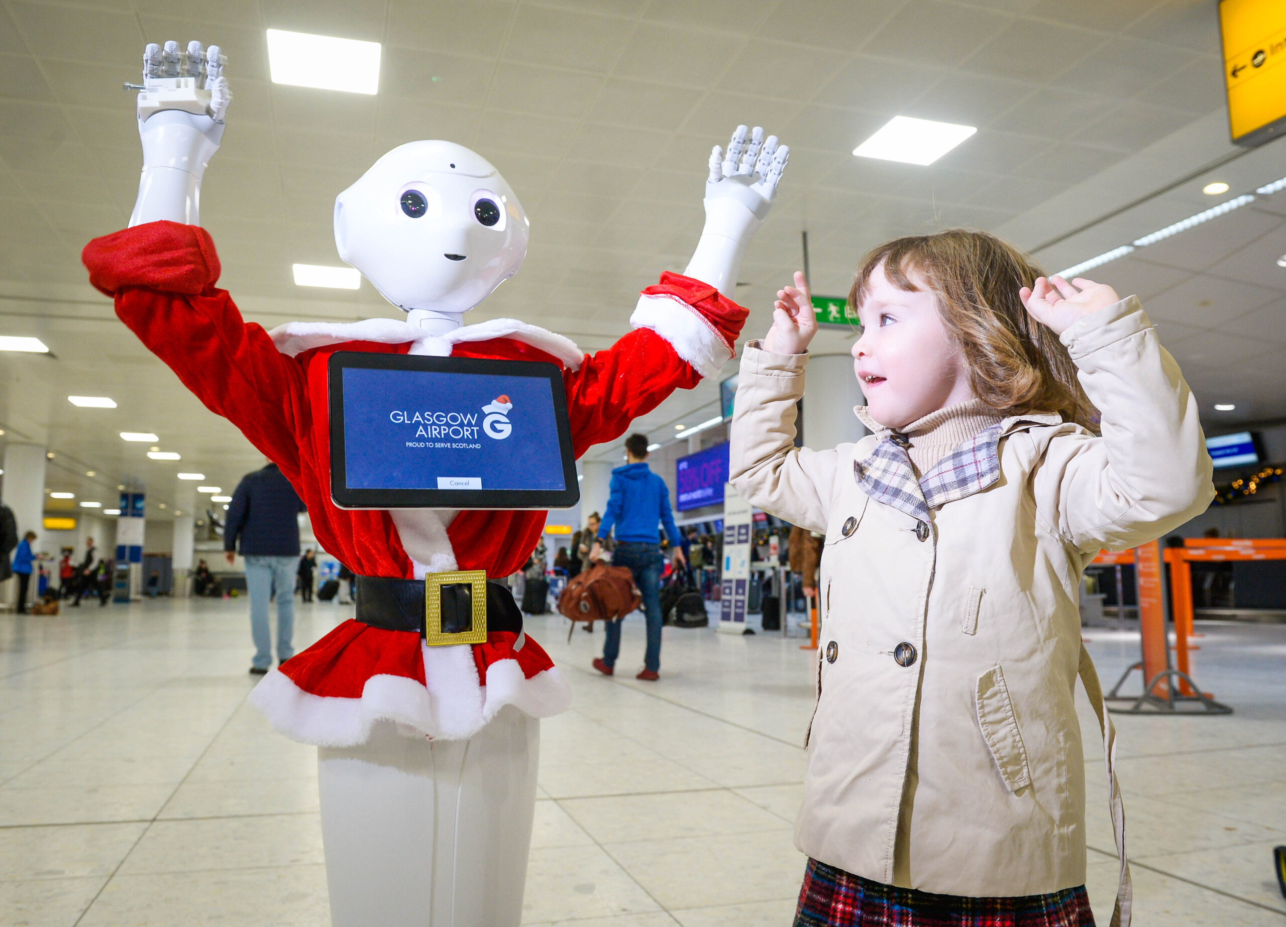 Glasgow has proved once again it has an AI for technology with todayÕs introduction of GLAdys Ð the UKÕs first humanoid robot airport ambassador. State-of- the-art GLAdys, whose name comes from GlasgowÕs International Air Transport Association (IATA) code, will be based in the main departures area and has initially been programmed to entertain passengers of all ages as they pass through the airport. Francesca Collery (3) dances with GLAdys