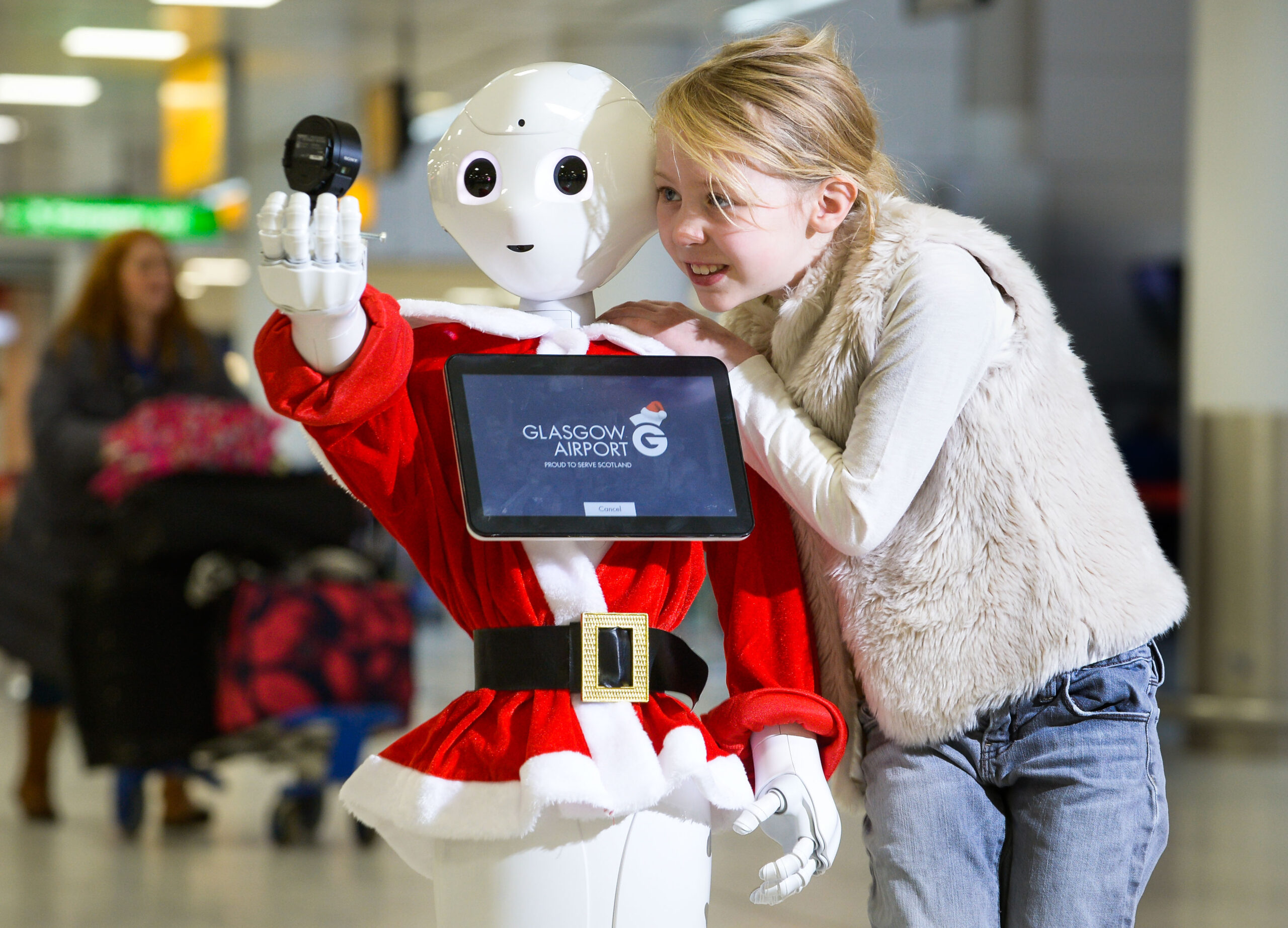 Glasgow has proved once again it has an AI for technology with todayÕs introduction of GLAdys Ð the UKÕs first humanoid robot airport ambassador. State-of- the-art GLAdys, whose name comes from GlasgowÕs International Air Transport Association (IATA) code, will be based in the main departures area and has initially been programmed to entertain passengers of all ages as they pass through the airport. Chloe Fortune, 8 gets a selfie taken with GLAdys