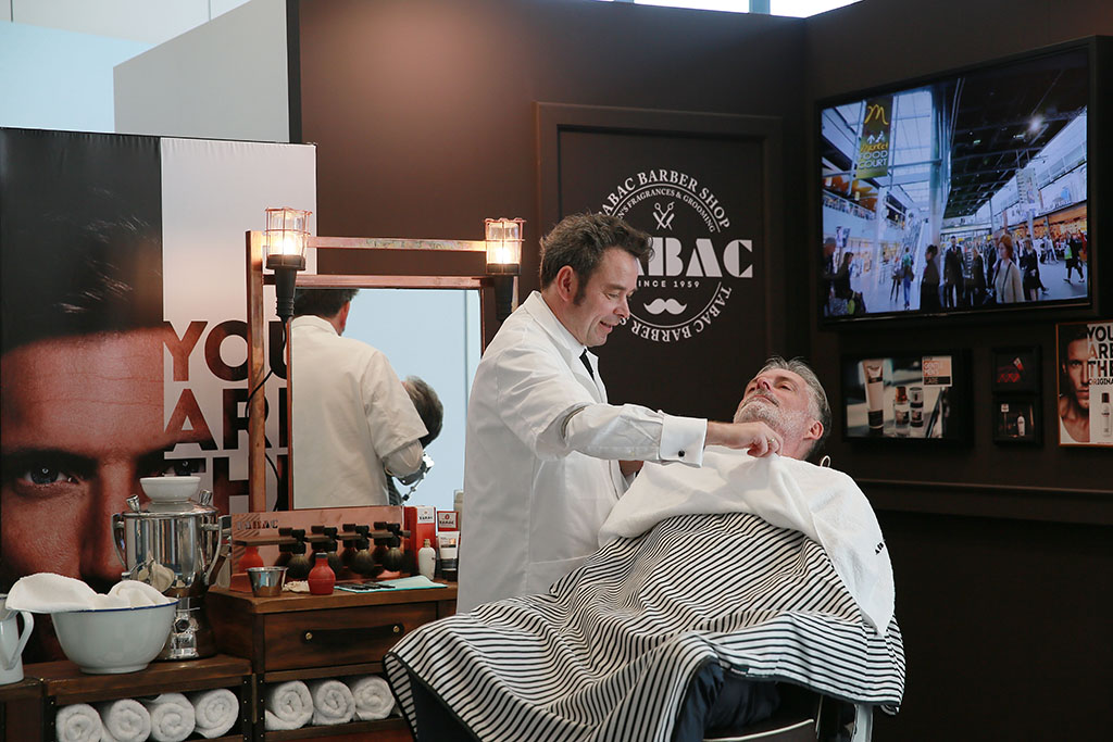Dutch Meesterbarbier Jan Heidemann in action at the Tabac Barbershop at the TFWA World Exhibition in Cannes last month 