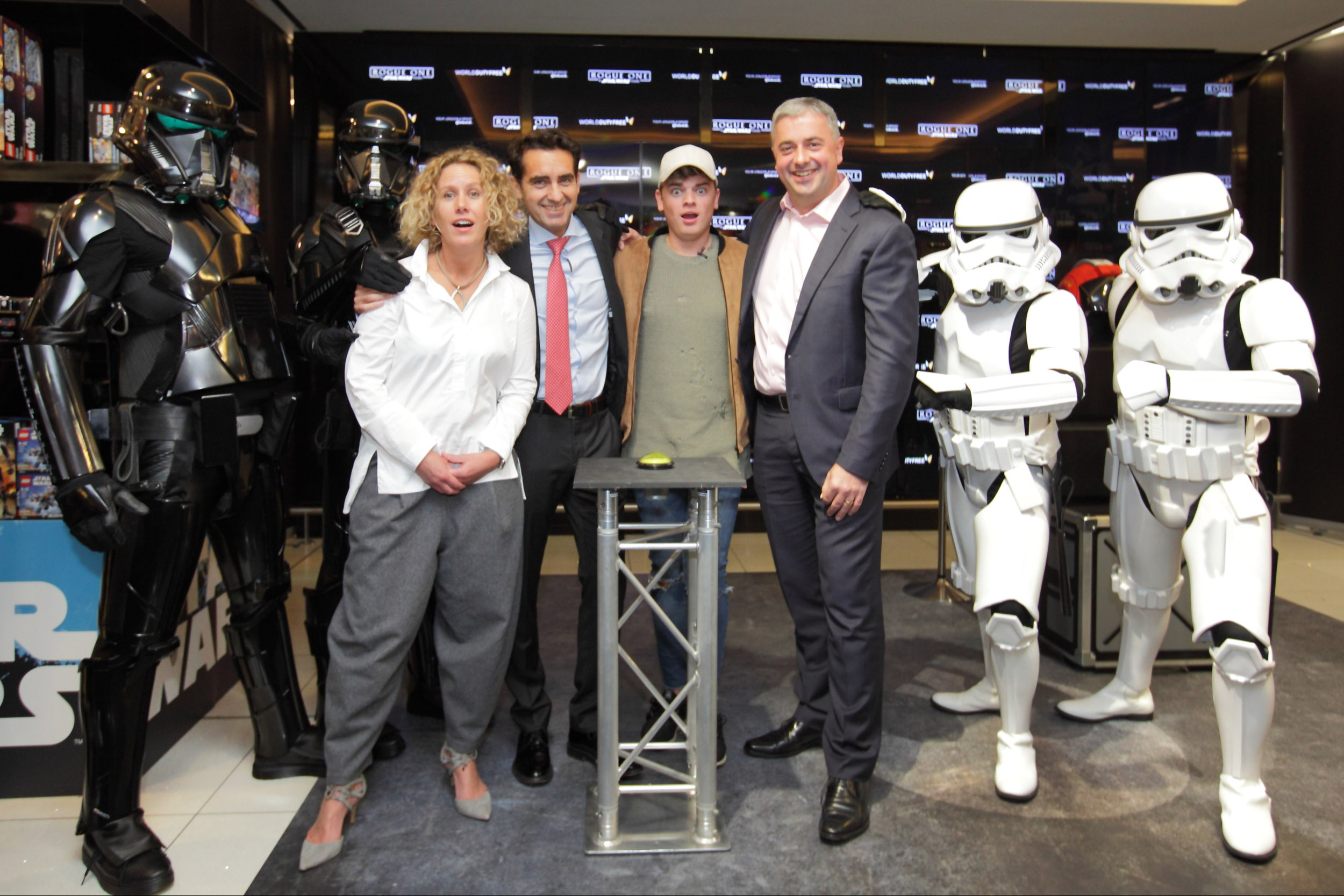 L-R Anna Hill CMO Disney, World Duty FreeÕs CEO, Eugenio Andrades, Jack Maynard, and GatwickÕs Chief Executive Stewart Wingate feel the Force as Rogue One: A Star Wars Story lands in Gatwick