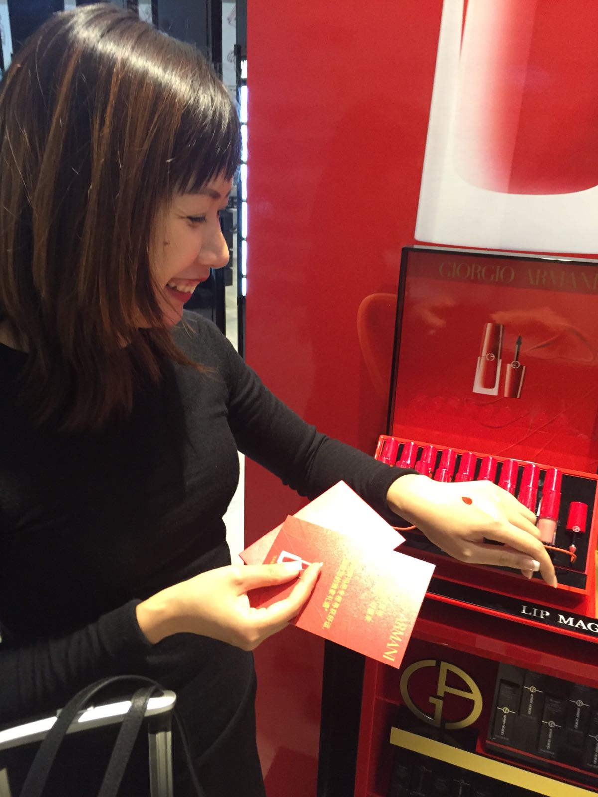 Good fortune awaits a visitor to Giorgio Armani Beauty at Los Angeles International Airport: exclusive gifts are revealed inside the red envelopes