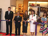 DFS Chairman Ed Brennan with the Vice-Governor of Okinawa and members of the popular Japanese all-girl band